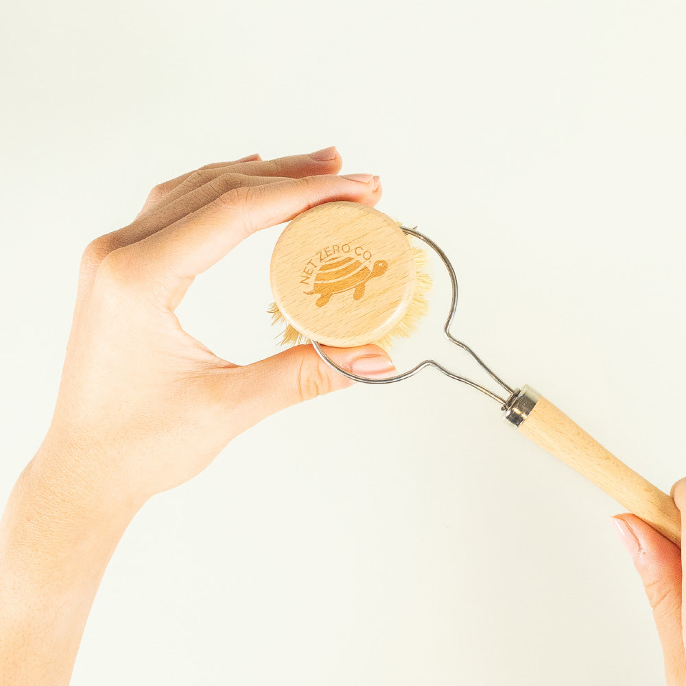 Hand Replacing Dish Brush Replacement Head On Net Zero Co. Brush