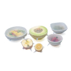 Net Zero Co. Stretch And Seal Lids Set Covering Half Cut Fruit