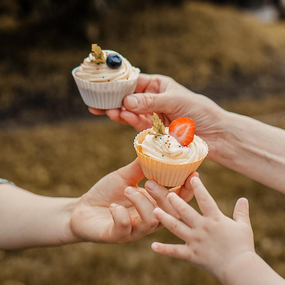 Baby Reaching For Cupcake In Silicone Muffin Cups